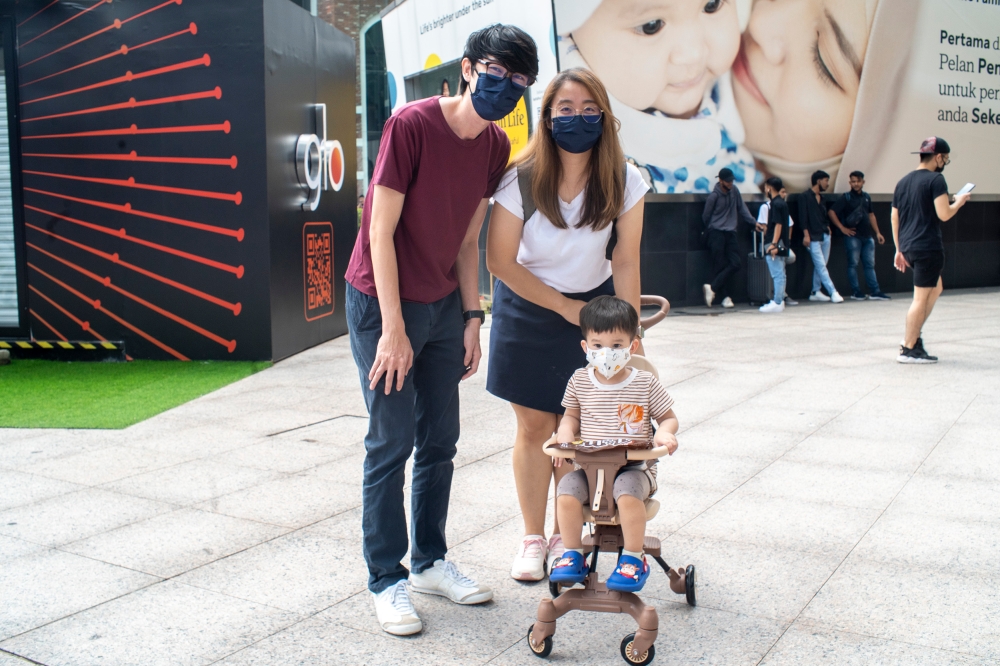 Educator Gim Teoh, 37, and his family pose for a photograph during the public holiday in conjunction with AHari Raya Aidilfitri April 24, 2023. — Picture by Shafwan Zaidon
