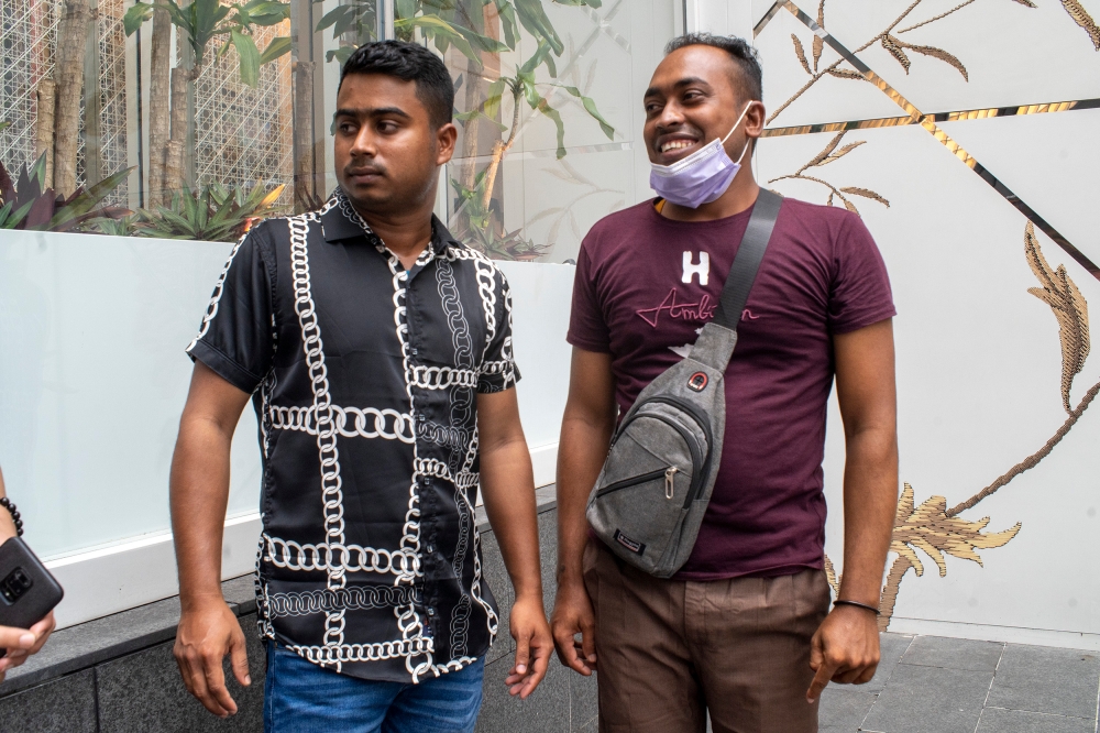 (From left) Rana, 21 and Baharam, 27, speak to Malay Mail during the public holiday in conjunction with AHari Raya Aidilfitri April 24, 2023. — Picture by Shafwan 