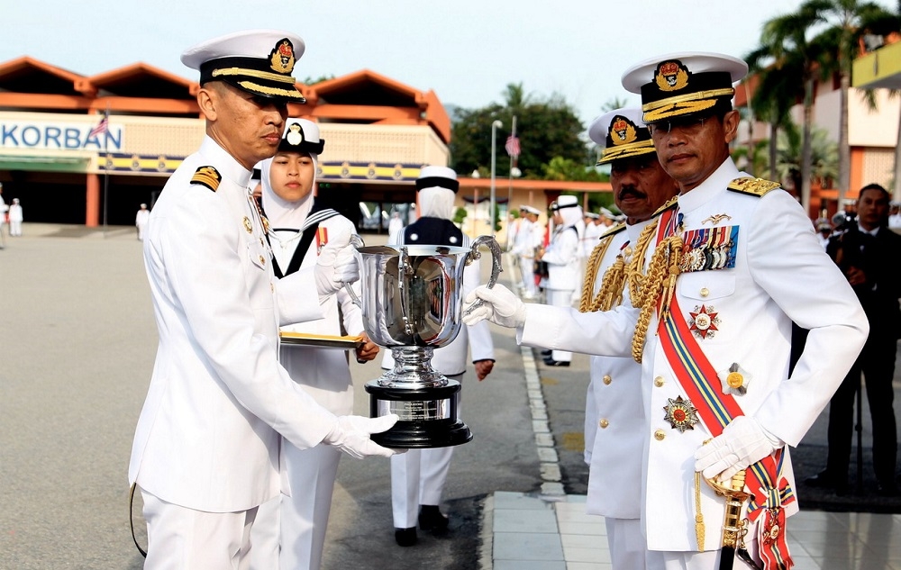 Navy chief Admiral Datuk Abdul Rahman Ayob (right) presents an award during the Royal Malaysian Navy ceremonial parade at Lumut RMN base April 27, 2023. — Bernama pic