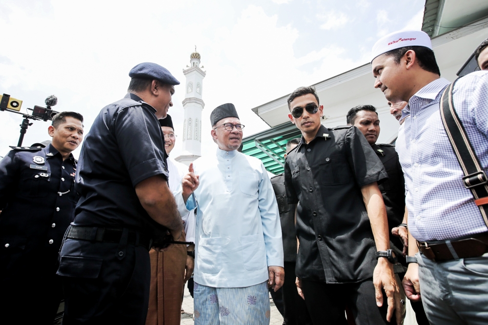 Prime Minister Datuk Seri Anwar Ibrahim arrives to perform Friday prayers at Jamiul Ehsan Mosque in Kampung Kubu Gajah, Sungai Buloh April 28, 2023. — Picture by Ahmad Zamzahuri