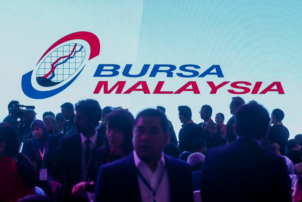 Bursa Malaysia ended the shortened trading week marginally lower today as investors sold financial services and plantation blue chips ahead of another shortened trading period next week, bucking the mainly positive regional trend. — Picture by Firdaus Latif