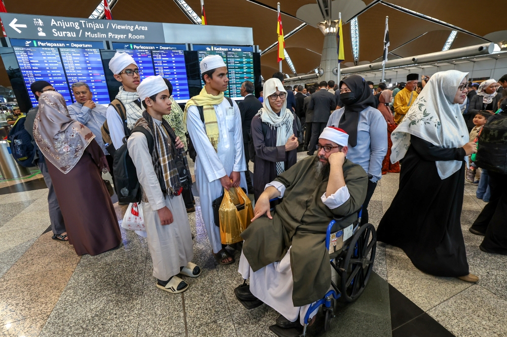 Part of a group of 30 Malaysians who returned from Sudan are seen at the Kuala Lumpur International Airport in Sepang April 28, 2023. — Bernama pic 