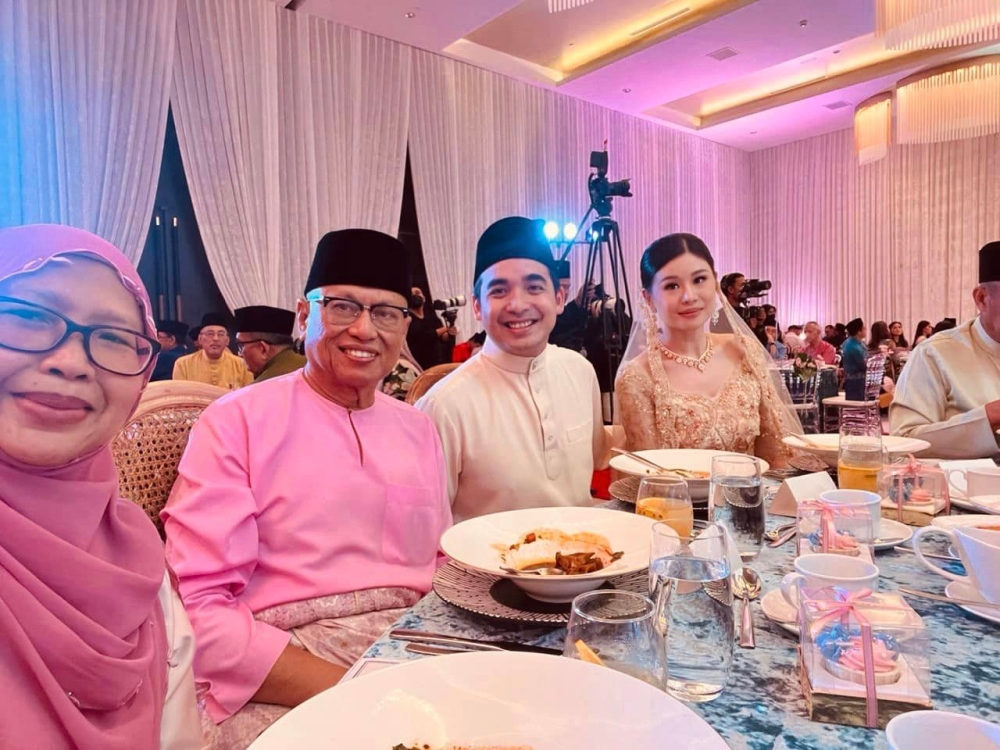 Puad (second from left) and his wife Datin Rubiah Leman pose with newly-engaged couple Norashman and fiancee Nicola. — Picture courtesy of Facebook/DrPuadZakarshi