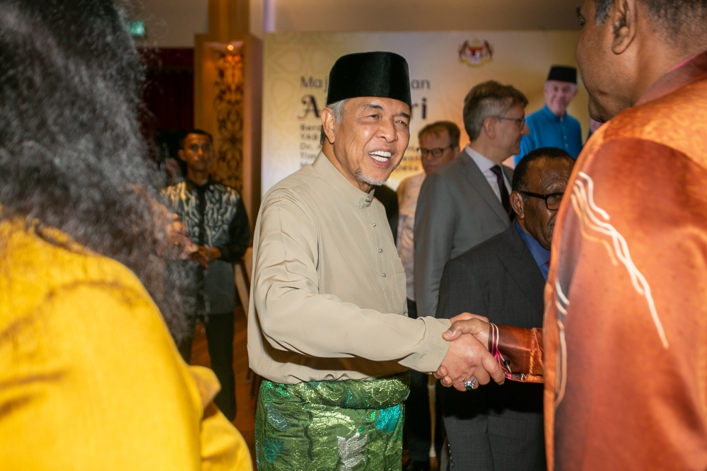 Deputy Prime Minister Datuk Seri Ahmad Zahid Hamidi greets guests during the Aidilfitri open house at Sri Satria, Putrajaya April 30, 2023. — Picture By Raymond Manuel
