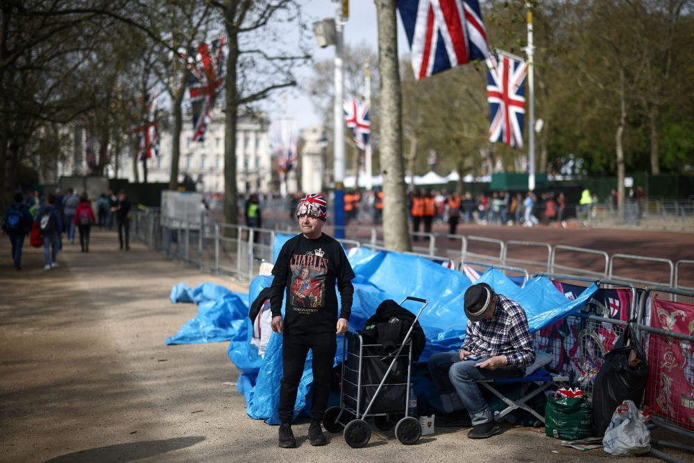 Royal fans John Loughrey and Sky London wait on The Mall outside Buckingham Palace, where they have set up camp, ahead of the Coronation of King Charles and Camilla, Queen Consort, in London, Britain, April 30, 2023. — Reuters pic