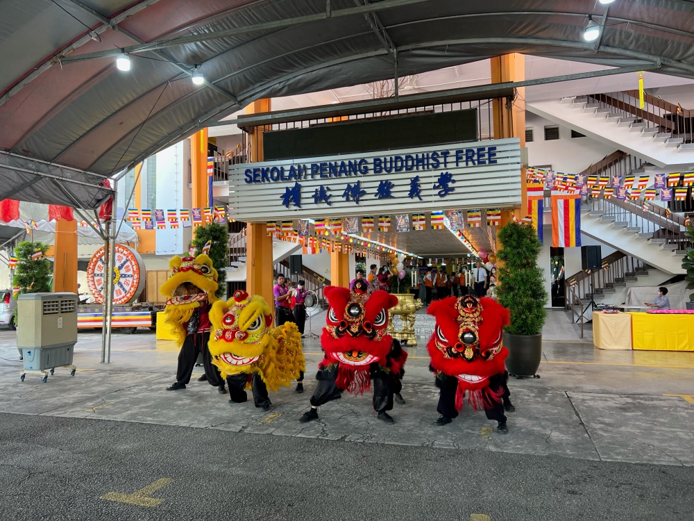 Lion dancers perform at the launch of the Penang Wesak Celebration Day in George Town, on April 30, 2023. — Picture by Opalyn Mok