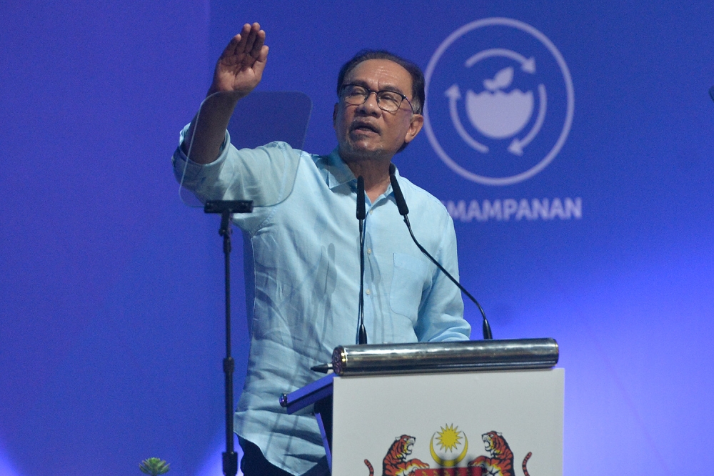 Prime Minister Datuk Seri Anwar Ibrahim speaks during the federal-level May Day celebration in Putrajaya May 1, 2023. ― Picture by Miera Zulyana