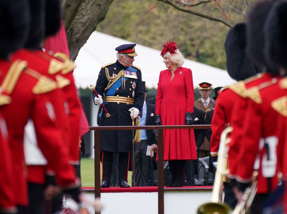 King Charles III and Camilla, the Queen Consort attend a ceremony where they presented new Standards and Colours to the Royal Navy; the Life Guards of the Household Cavalry Mounted Regiment; The King's Company of the Grenadier Guards, and The King's Colour Squadron of the Royal Air Force, at Buckingham Palace in London April 27, 2023. — Yui Mok/Pool/Reuters pic