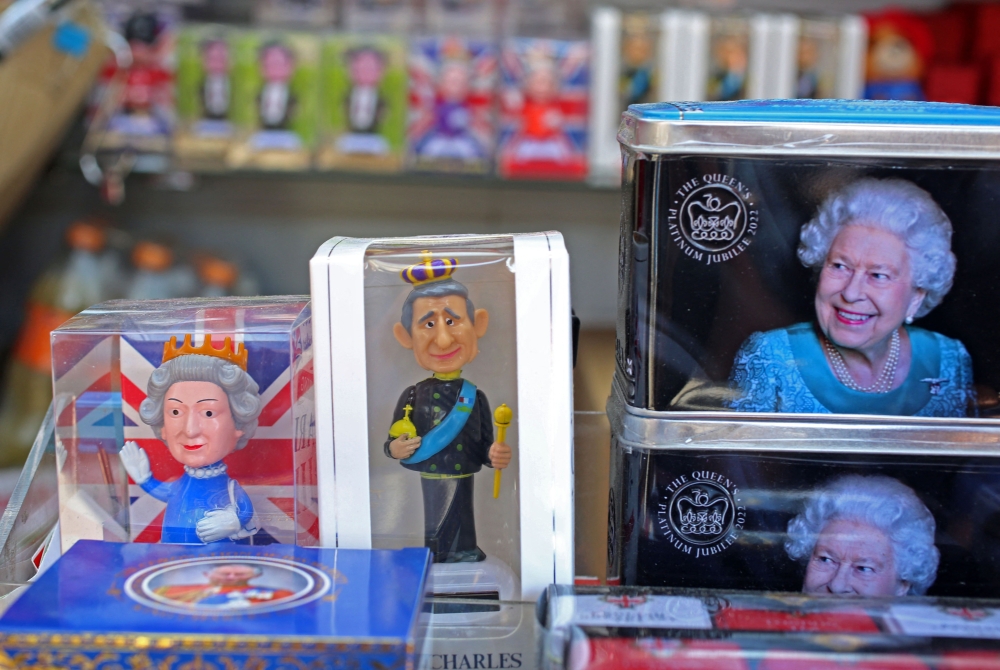 Royal souvenirs are seen for sale on a stall in central London on April 29, 2023 ahead of the coronation ceremony of Charles III and his wife, Camilla, as King and Queen of the United Kingdom and Commonwealth Realm nations on May 6, 2023. — AFP pic