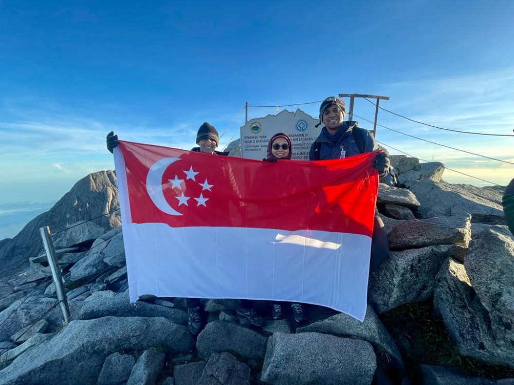 Vanu (left) with his wife Jayanthi and the Singapore High Commission’s First Secretary (Political) Warran Kalasegaran on the top of Mount Kinabalu in Sabah April 28, 2023 -- Picture courtesy of the Singapore High Commission