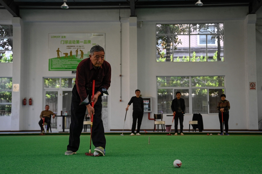 Elderly people playing gateball at a university in Rudong. — AFP pic