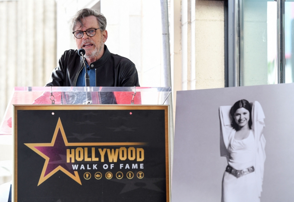 Actor Mark Hamill speaks at the ceremony for actress Carrie Fisher being honoured posthumously with a Star on the Hollywood Walk of Fame on May 4, 2023 in Hollywood, California.— AFP pic