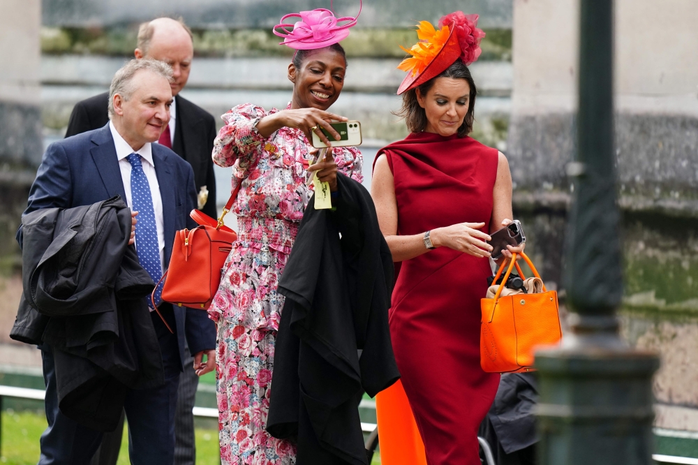 Guests arrive at Westminster Abbey in central London on May 6, 2023, ahead of the coronations of Britain's King Charles III and Britain’s Camilla, Queen Consort. — AFP pic