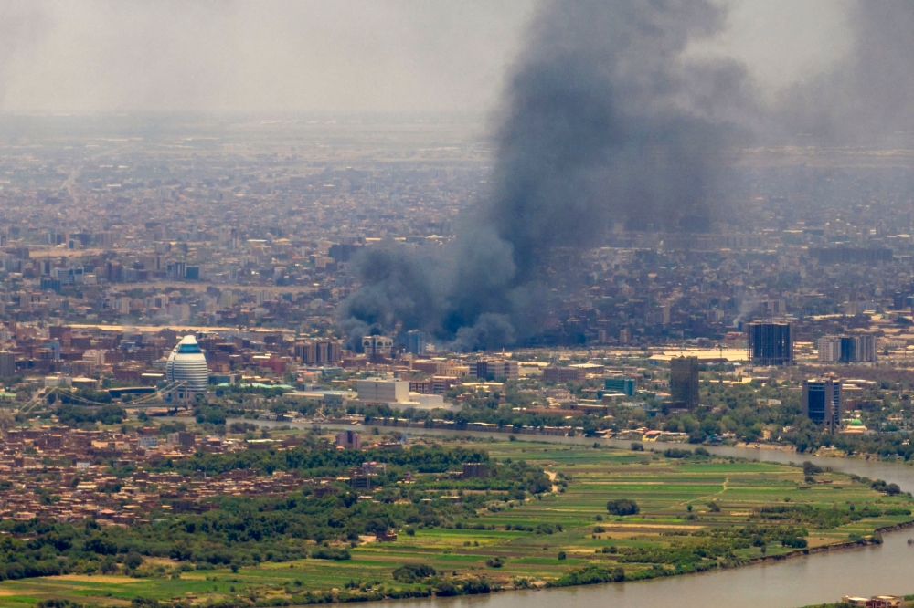 Smoke billows during fighting in the Sudanese capital Khartoum, on May 3, 2023. — AFP pic