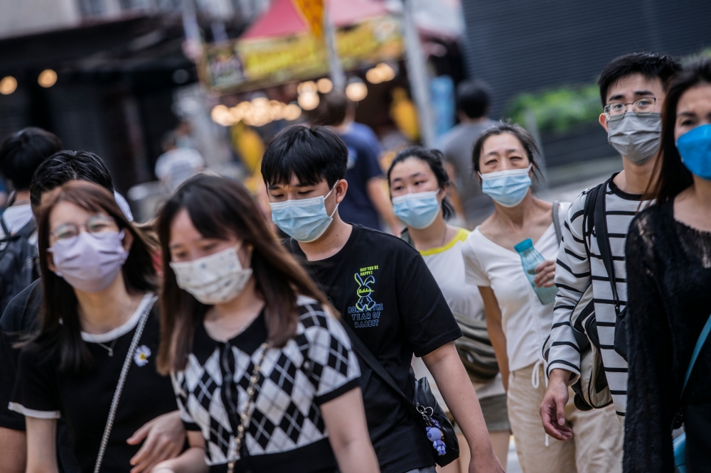 File photo of people wearing face masks amid  the emergence of new Covid-19 variants and sub-variants in Bukit Bintang January 4, 2023. — Picture by Hari Anggara