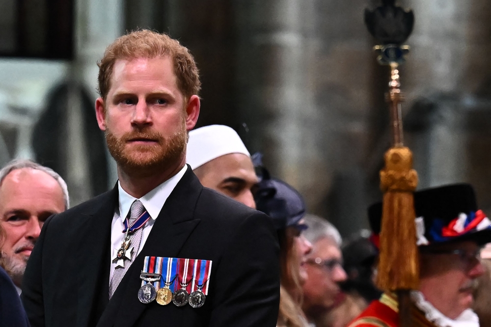 Britain’s Prince Harry, Duke of Sussex looks on as Britain’s King Charles III leaves Westminster Abbey after the Coronation Ceremonies in central London on May 6, 2023. — AFP pic