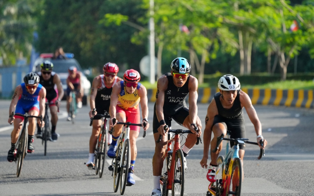 Athletes in action at the duathlon event held at Kep Town Beach. — Reuters pic