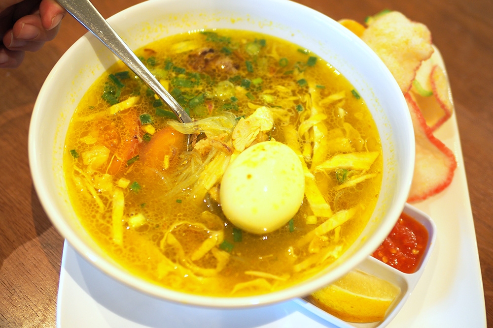 Soto Ayam is comfort food with a fragrant turmeric tinged chicken broth.