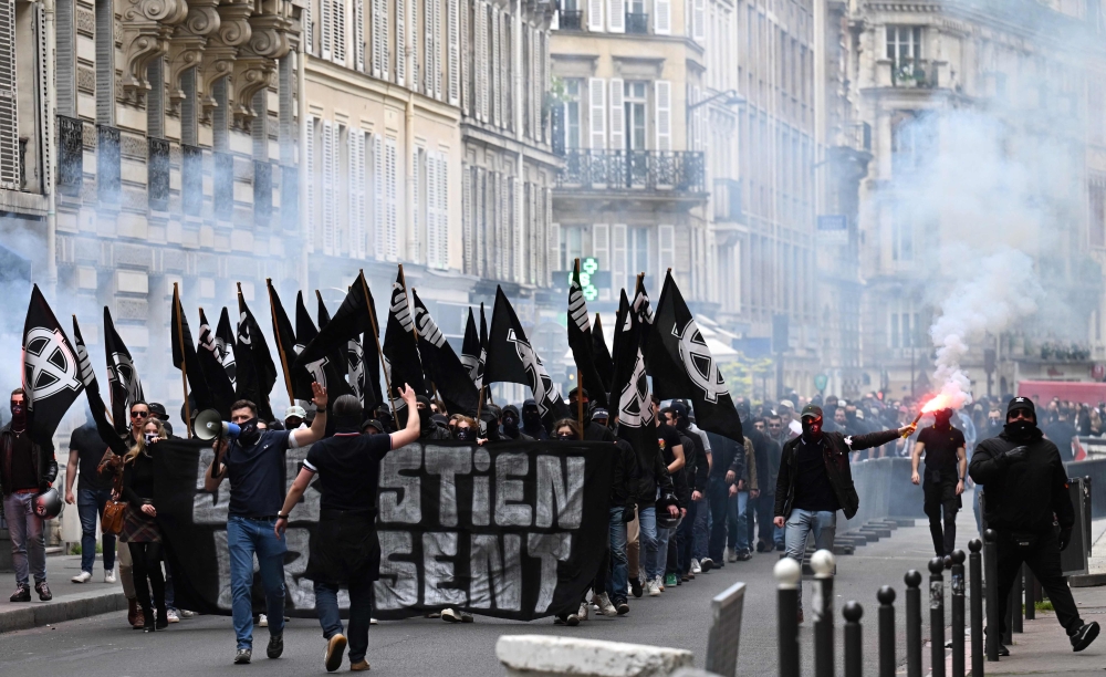 Members of far-right group ‘Comite du 9 Mai’ (committee of May 9) gather to commemorate the 29th anniversary of the death of Sebastien Deyzieu of the ‘Oeuvre Francaise’ ultranationist group, during a rally in Paris May 6, 2023. — AFP pic