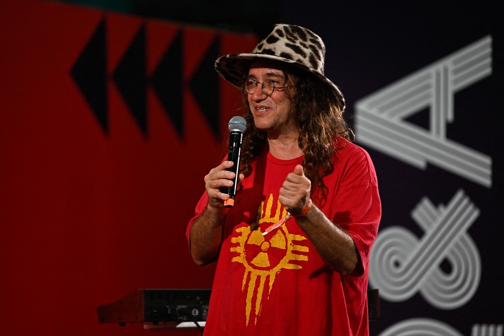 SingularityNET Founder and CEO Ben Goertzel performs along with the AI robot Desdemona (out of frame) during the Web Summit Rio 2023. — AFP pic