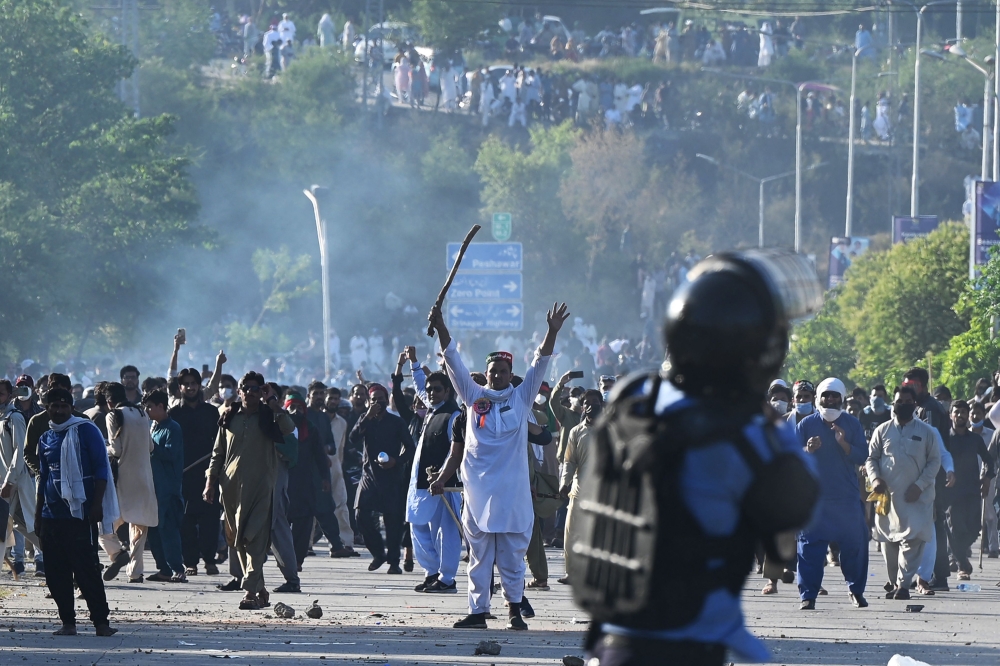Pakistan’s political turmoil intensified late yesterday with violent nationwide protests swelling and the government deploying the military. — AFP pic