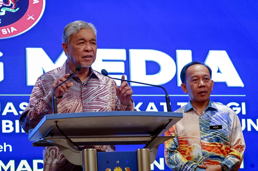 Deputy Prime Minister Datuk Seri Ahmad Zahid Hamidi speaks at the meeting of the Supreme Committee on Violence Control (JPTKK) in Putrajaya May 11, 2023. — Bernama pic