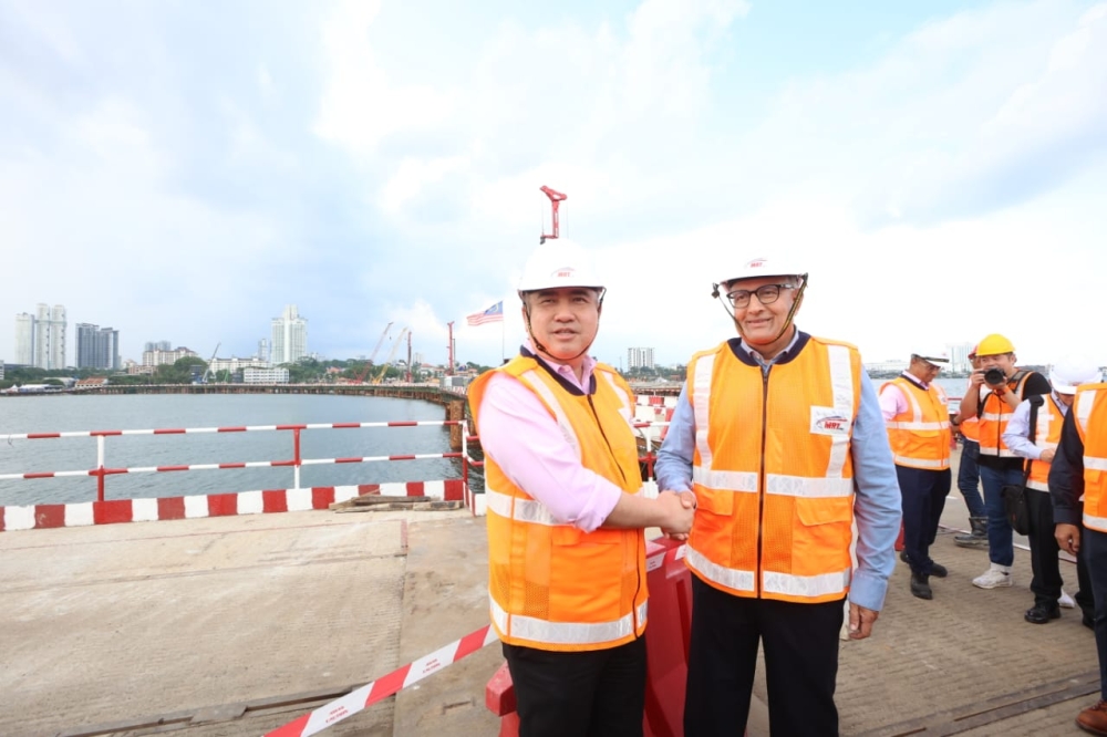 Transport Minister Anthony Loke (left) and his Singaporean counterpart, S. Iswaran, pose for photographs while inspecting the Johor Baru-Singapore Rapid Transit System (RTS) project in Stulang Laut on May 11, 2023. — Picture courtesy of the Johor Royal Press Office