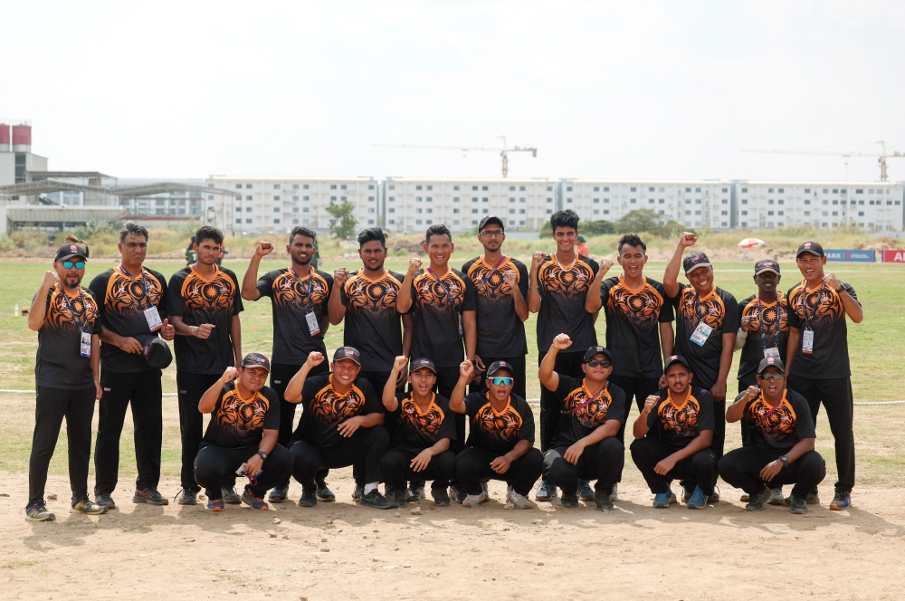 The national men’s cricket squad members pose with the silver medal after the 2023 Cambodia SEA Games final at the AZ Group Cricket Oval, Phnom Penh May 11, 2023. — Bernama pic