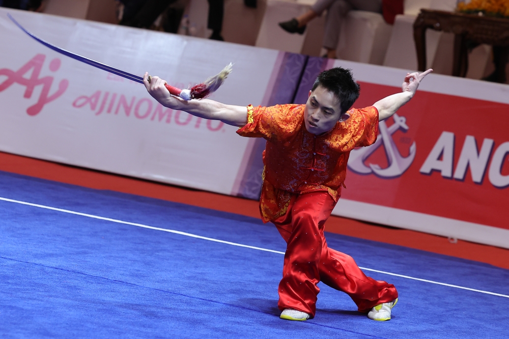 National wushu exponent Wong Weng Son is seen in action during the 2023 SEA Games Jianshu  Qiangshu event at the Chroy Changvar Convention Centre, Phnom Penh May 11, 2023. — Bernama pic