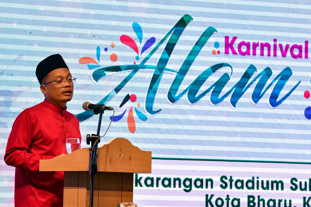 Natural Resources, Environment and Climate Change Minister Nik Nazmi Nik Ahmad delivers a speech during the launch of ‘Karnival Alam Kita’ at the Sultan Muhammad IV Stadium, Kota Baru May 11, 2023. — Bernama pic