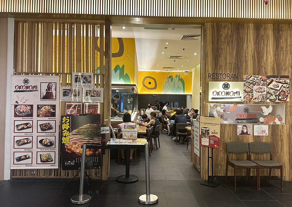 The signboard may be a little small but you know there's okonomiyaki with that large poster to entice you inside.