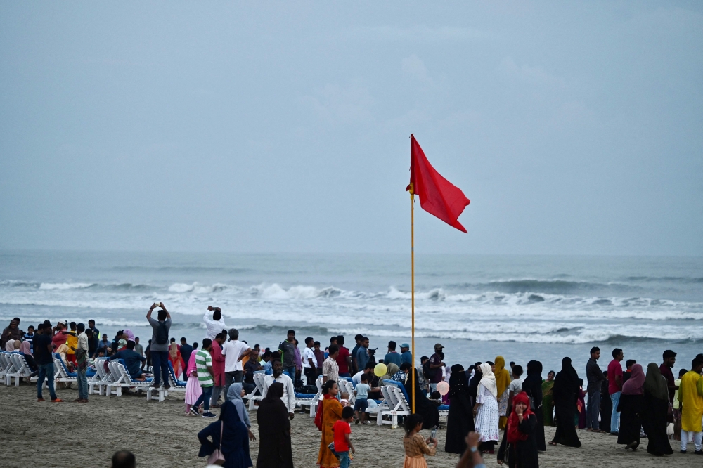 Red flag flatters in Cox’s Bazar sea beach as a warning sign for upcoming cyclone Mocha in Cox's Bazar on May 12, 2023. — AFP pic