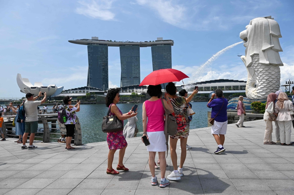 The temperature in Singapore hit 37 degrees Celsius on May 13, matching the city-state's 1983 record. — AFP pic