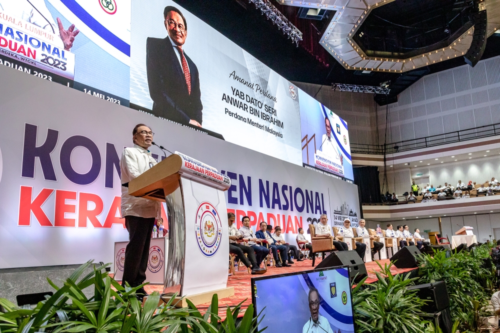 Pakatan Harapan chairman Datuk Seri Anwar Ibrahim delivers his speech during the Unity Government National Convention at World Trade Centre Kuala Lumpur May 14, 2023. — Picture by Firdaus Latif