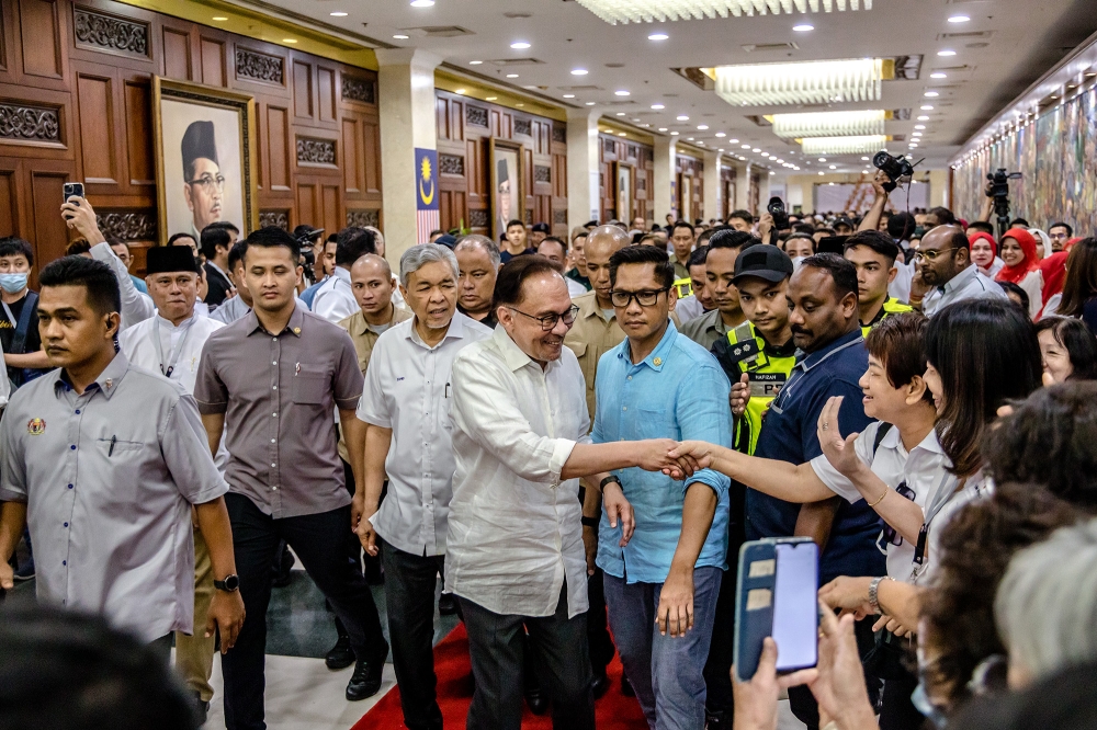 The biggest reaction, however, was for Anwar — formerly ostracised and later demonised by Umno — who said he could not believe that one day he would be welcomed into the World Trade Centre with open arms. — Picture by Firdaus Latif      