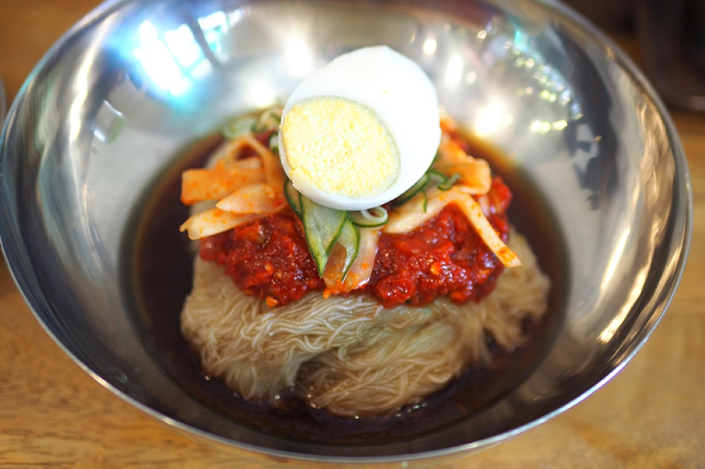 If you can take spicy food, try the Bibim Nengmyun or cold noodles with a spicy 'bibim' sauce