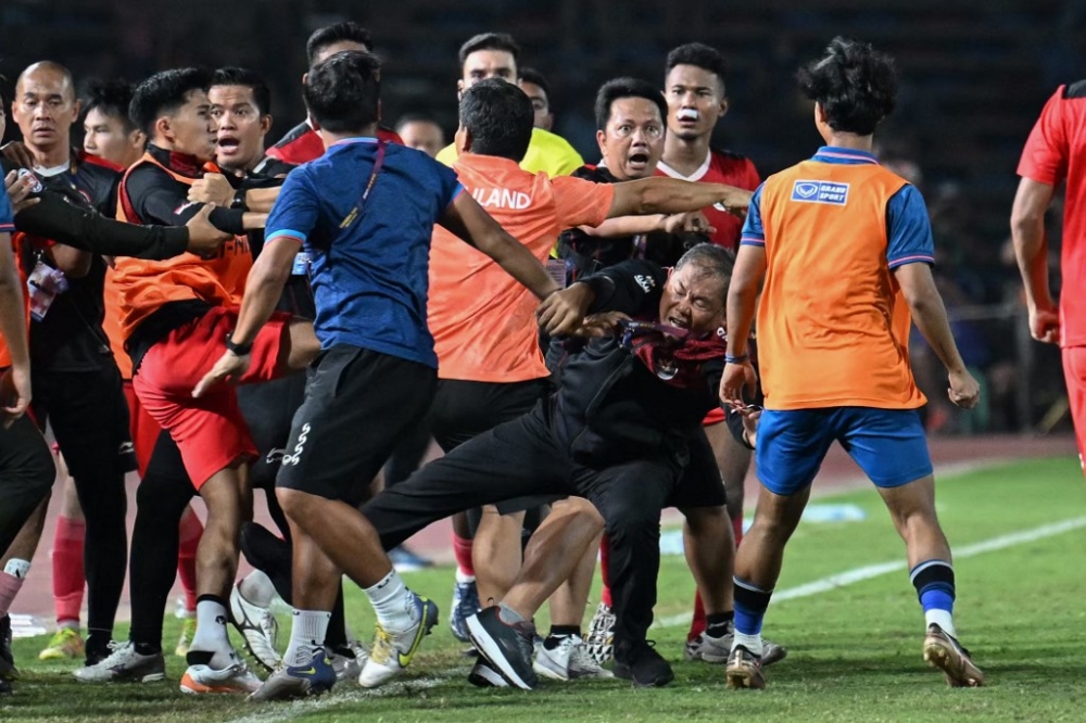 A fight breaks out on the sidelines of the men’s football final match between Thailand and Indonesia during the 32nd Southeast Asian Games (SEA Games) in Phnom Penh May 16, 2023. — AFP pic
