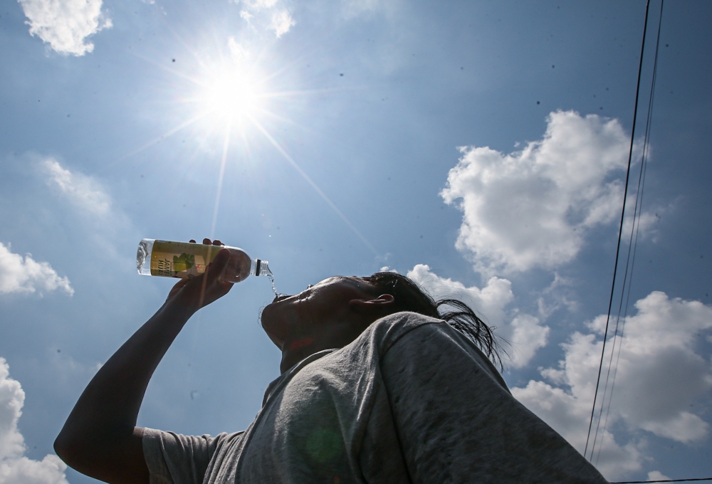 The current hot weather is making the unscheduled water and power disruptions on Labuan worse. — Picture by Farhan Najib