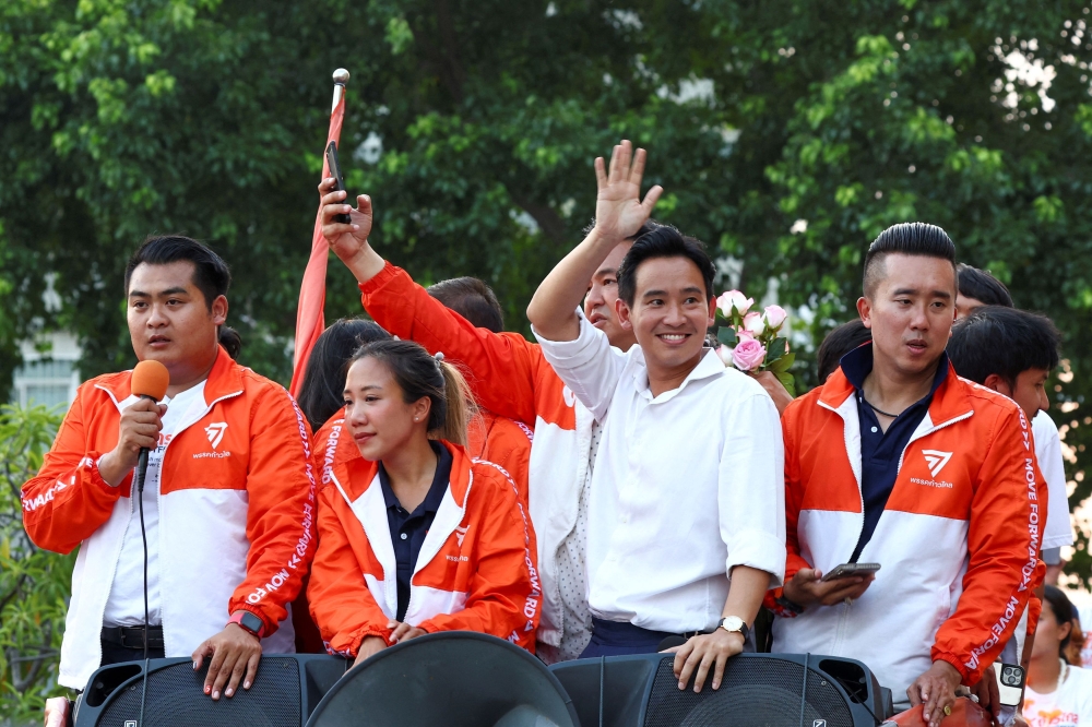 Move Forward leader Pita Limjaroenrat was seen greeting senior officials from five other parties at a Bangkok restaurant before ushering them upstairs for closed-door talks. — Reuters pic