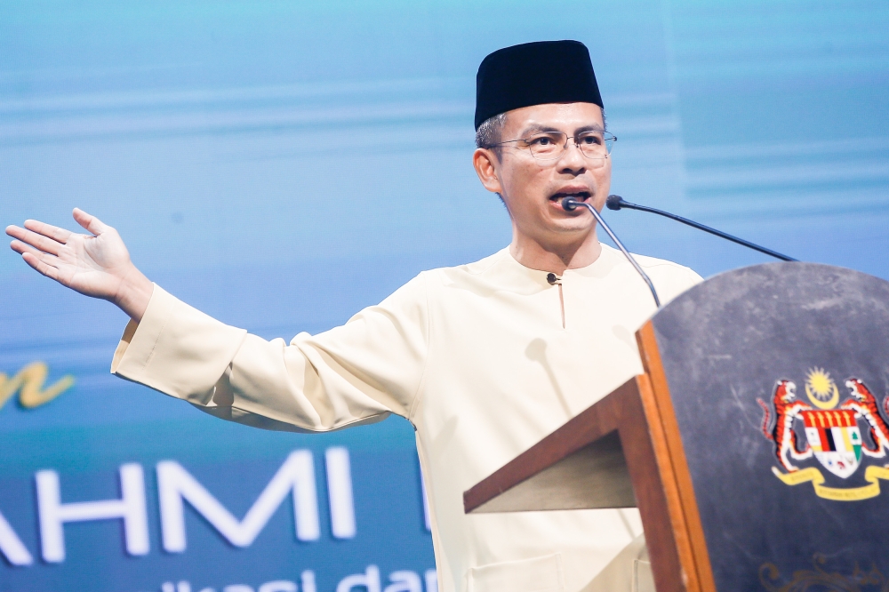 Communications and Digital Minister Fahmi Fadzil says MCMC has been instructed to take action on Coldplay ticket resale advertisements on social media. ― Picture by Hari Anggara