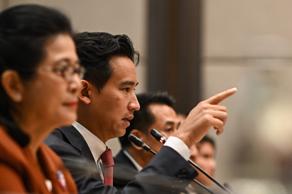 Move Forward Party leader and prime ministerial candidate Pita Limjaroenrat addresses a press conference with potential coalition partners in Bangkok. — AFP pic