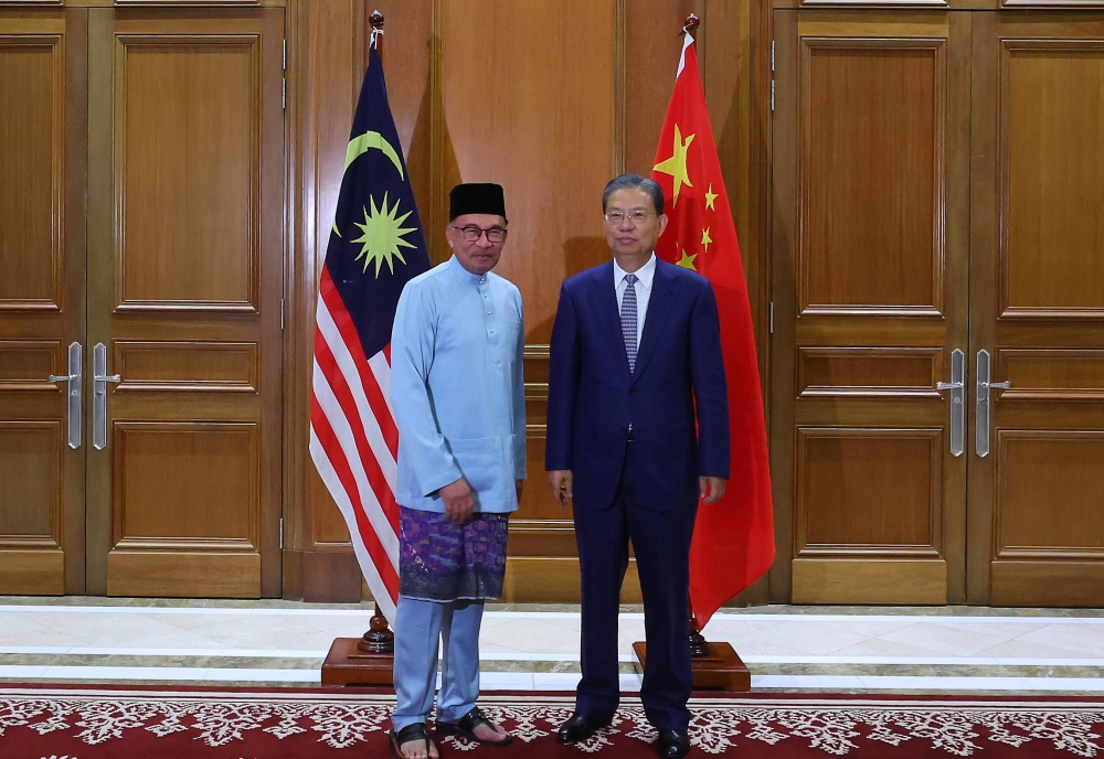 Prime Minister Datuk Seri Anwar Ibrahim receives a courtesy call from China’s 14th National People’s Congress (NPC) Standing Committee Chairman Zhao Leji in Putrajaya May 19, 2023. — Bernama pic