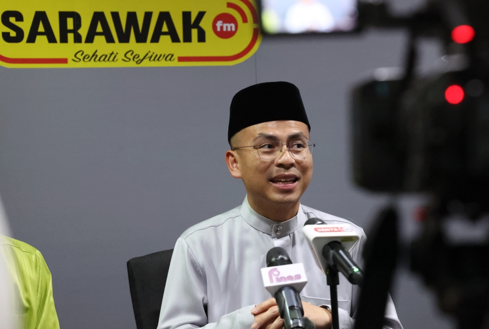 Communications and Digital Minister Fahmi Fadzil speaks at a press conference after visiting the Sarawak Broadcasting Department in Kuching May 19, 2023. — Bernama pic