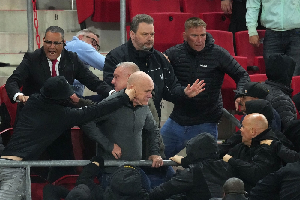 Riots break out between supporters in the stands after the UEFA Conference League semi-final match between AZ Alkmaar and West Ham United FC at the AFAS stadium, in Alkmaar May 18, 2023. — ANP/AFP pic