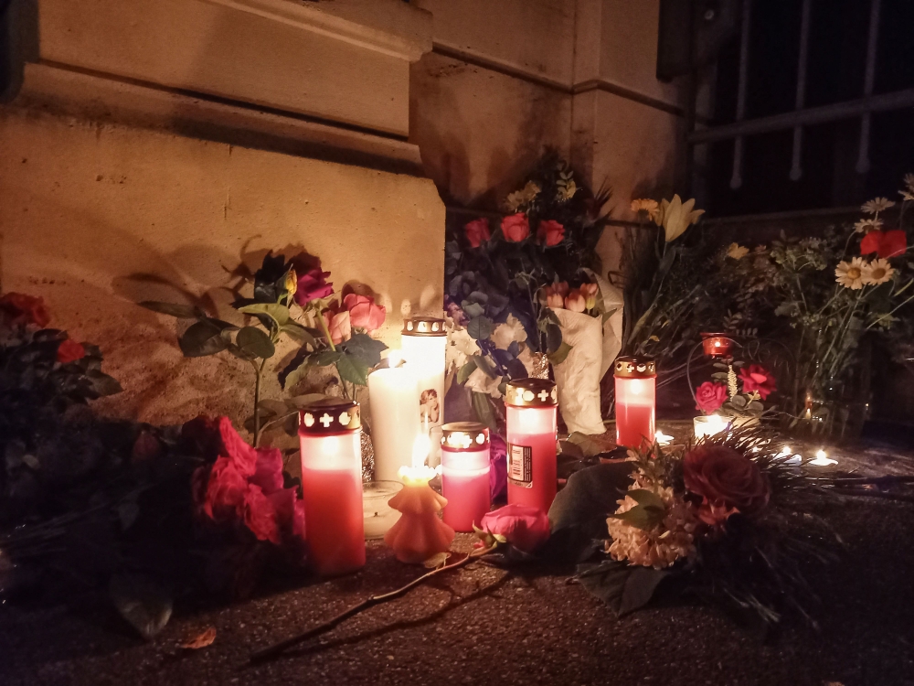A large crowd began gathering outside the cast-iron gate, shrouded in darkness, with fans walking up one by one to lay flowers or set out candles, some flickering through red-tinted glass jars. — AFP pic