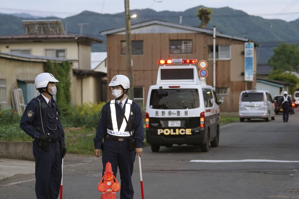 Japanese police today detained a suspect who had been holed up in a building after allegedly killing four people including two police officers in a gun and knife attack. — Reuters pic/Kyodo