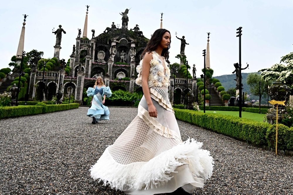 A model walks during the dress rehearsal of the Louis Vuitton Cruise 2024 fashion show. — AFP pic