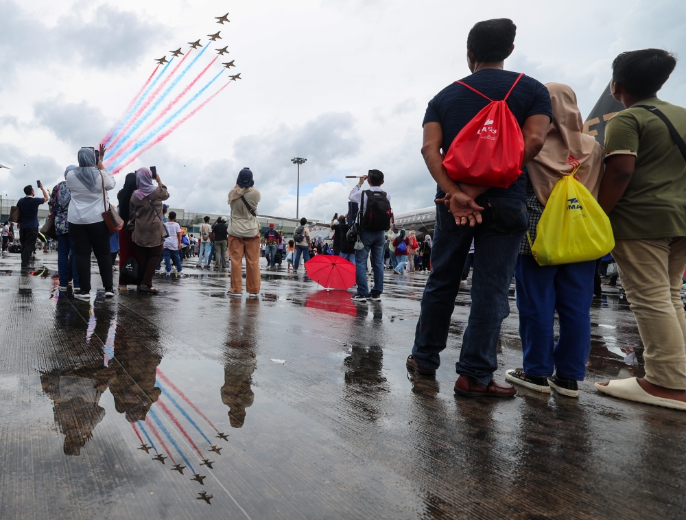 Visitors take pictures and videos of an aerial show at Lima ‘23 in Langkawi May 26, 2023. — Bernama pic