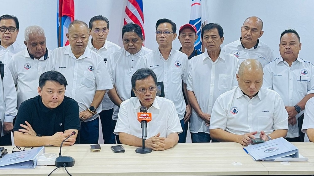 Parti Warisan president Datuk Seri Shafie Apdal (seated, centre), vice president Datuk Darell Leiking (seated, left), Warisan general secretary Datuk Loretto S. Padua with other Warisan members and leaders during the press conference May 26, 2023. — Borneo Post pic