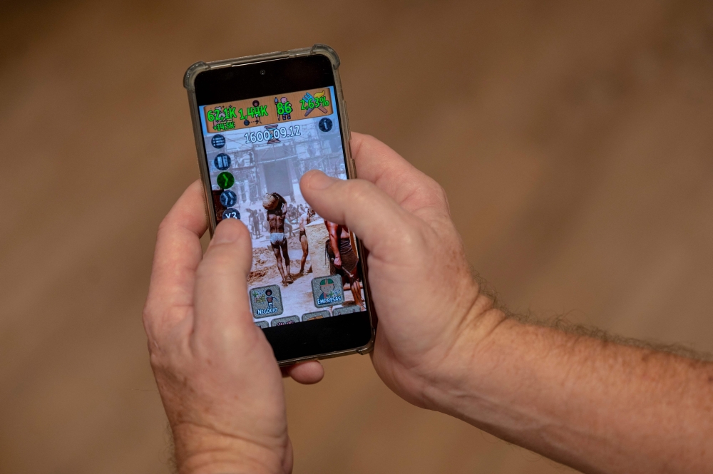 An illustration shows a screen grab of a video game called ‘Slavery Simulator’ in Rio de Janeiro May 26, 2023. —AFP pic